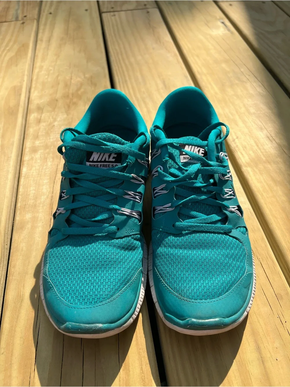 Nike Women’s Teal Athletic Running Shoes with Black Swoosh. Nike Free 5.0
